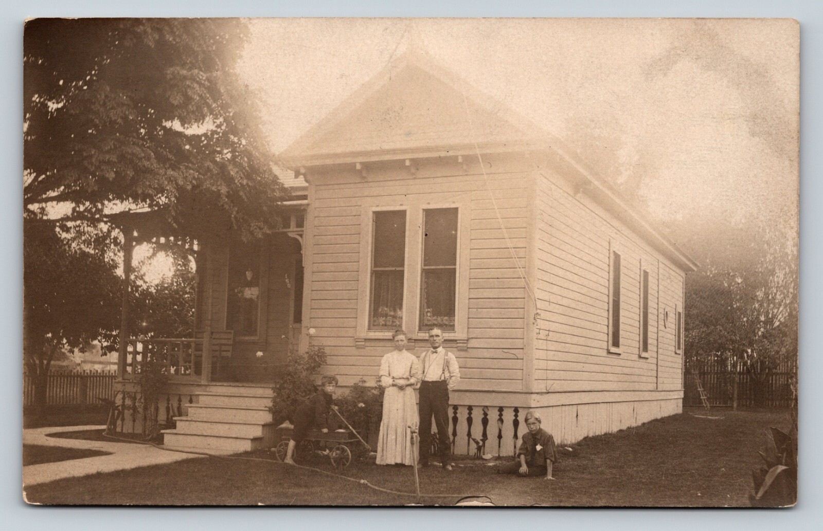 c1906 RPPC Couple with Boy in Wagon & One on Ground ANTIQUE Postcard 1320